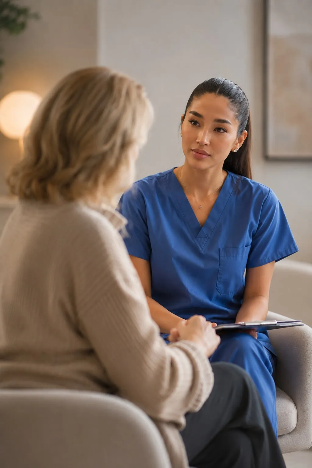 Executive Health clinician speaking with a patient during a private consultation.